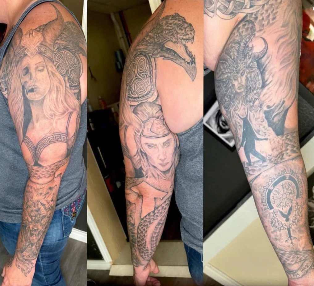 Black and grey Norse mythology full sleeve tattoo shown from three angles, with Hel, a dragon, Valkyrie, Jormungandr serpent and Vegvisir runes